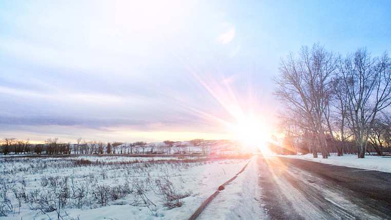 Winter scene with a sunset over an Albertan river valley